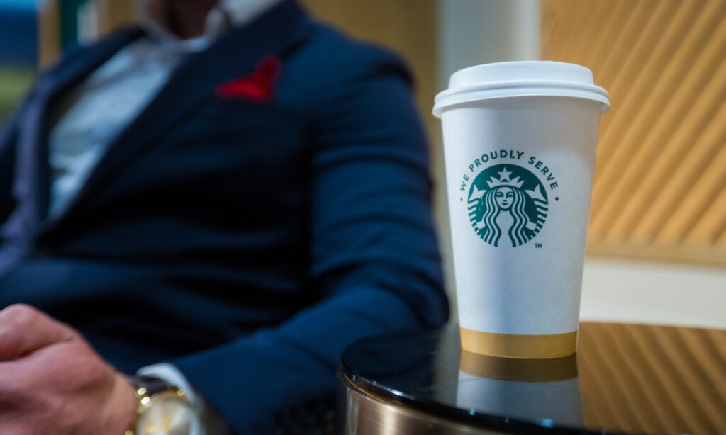Starbucks coffee cup on a side table in the Golden Mesa lobby near Panhandle Press Coffee Shop.
