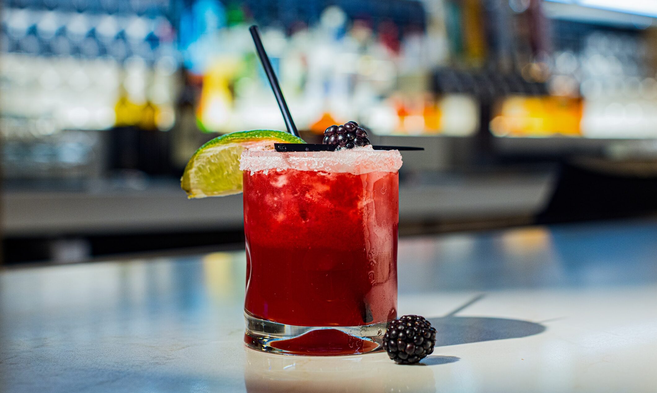 Blackberry margarita with a sugared rim, lime wedge and fresh blackberries at Cimarron Ridge Bar in Golden Mesa Casino.