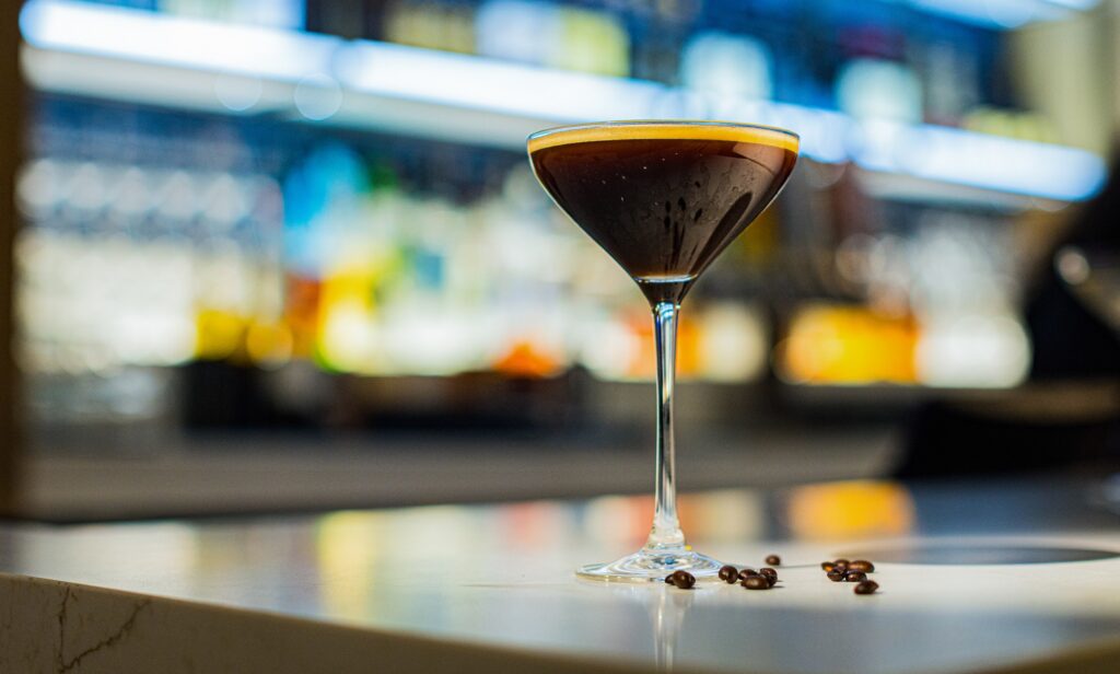 Espresso martini with coffee beans in a stemmed glass at Cimarron Ridge Bar in Golden Mesa Casino.