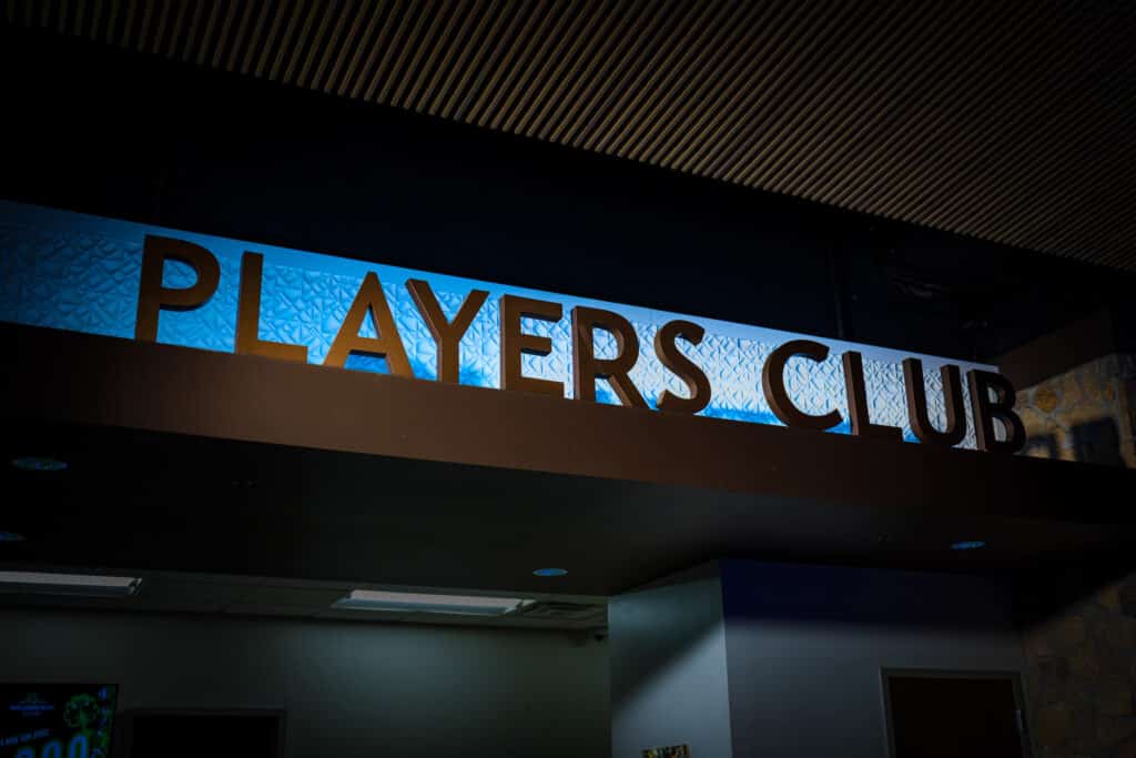 Players Club sign with blue backlighting above the Golden Mesa Players Club desk inside the casino.