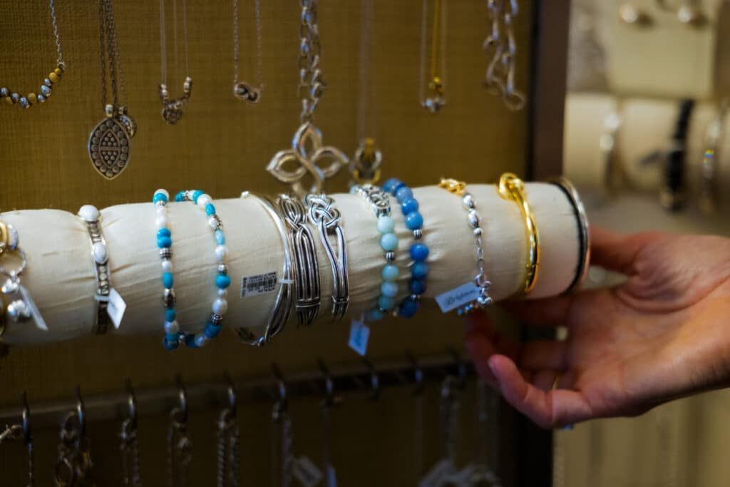 Close-up of bracelets and necklaces for sale at Silver Saddle Gift Shop inside Golden Mesa Casino & Hotel.