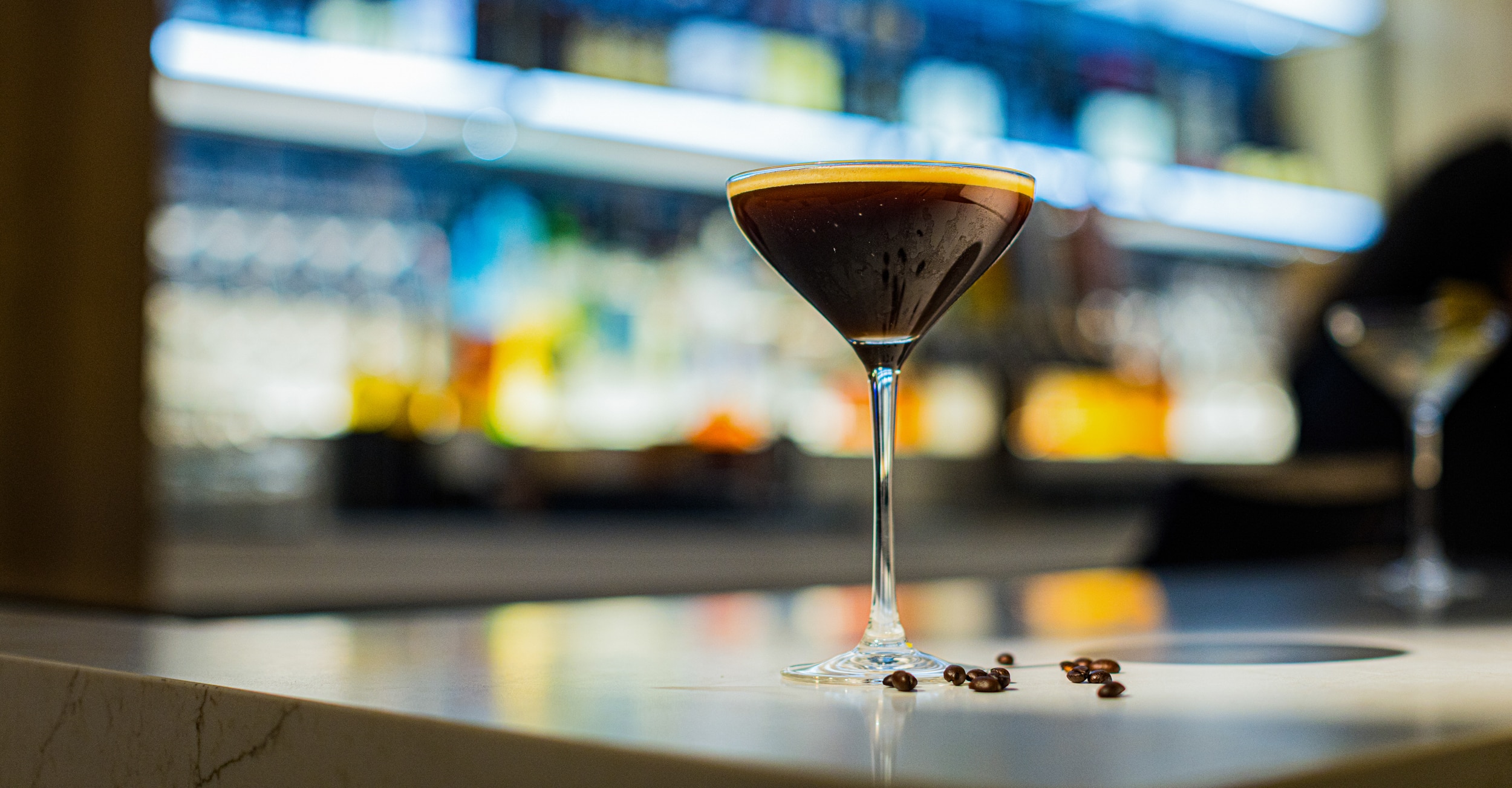 Espresso martini with coffee beans in a stemmed glass at Cimarron Ridge Bar in Golden Mesa Casino.