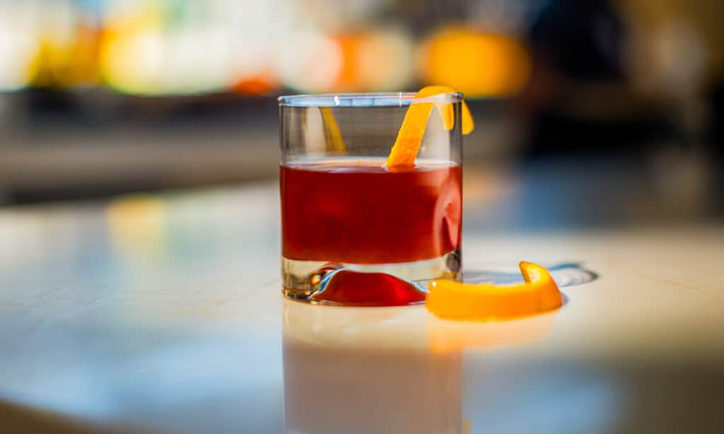Woodford Reserve Old Fashioned with orange peel garnish on the bar at Gold Spur Bar inside Golden Mesa Casino & Hotel.